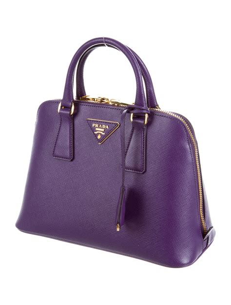 prada saffiano luggage bag.